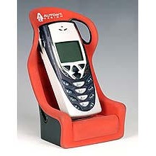 Podstawka pod telefon w ksztacie fotela kubekowego.